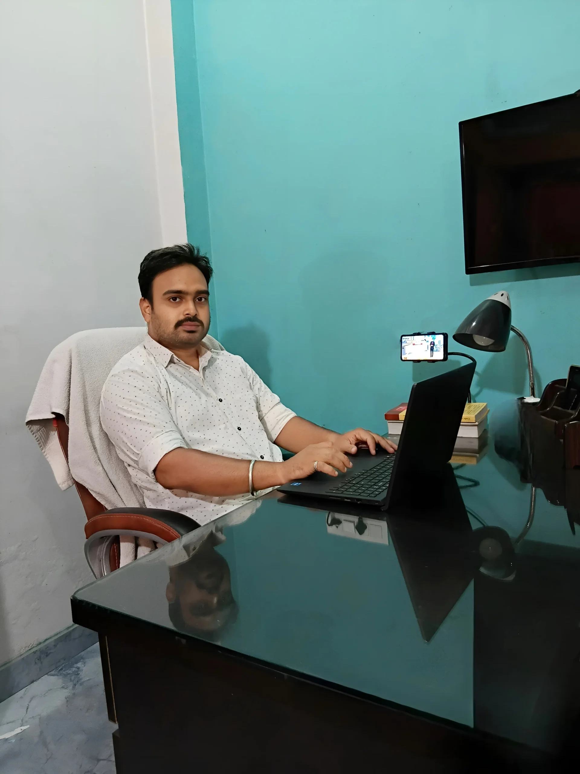 Raghaw Mishra, Meta Ads and Google Ads consultant, at his desk in Lucknow